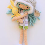 amigurumi girl with lamb hat and stuffed rabbit toy crochet pattern